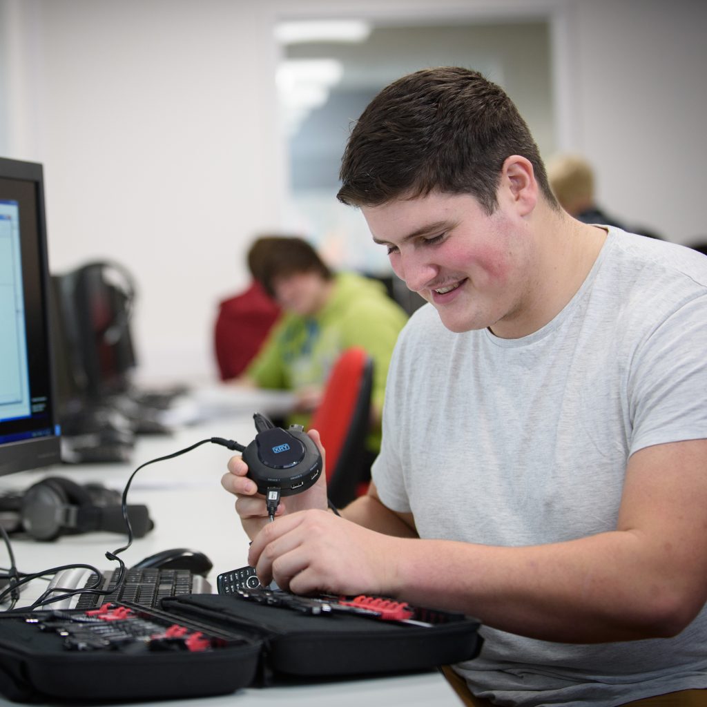 Student on Computer Science course using tool on mobile phone at Park campus