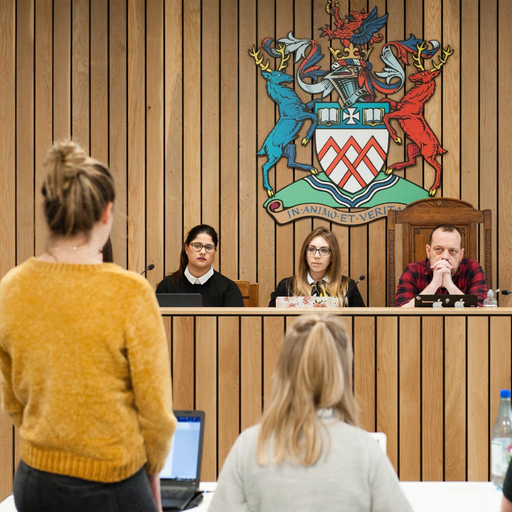 Students on Law course doing practical in Moot room at Oxstalls campus