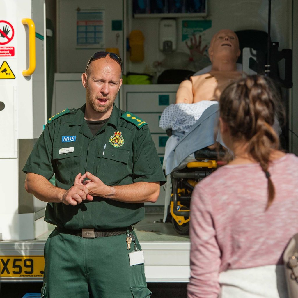 Paramedic giving a talk to students