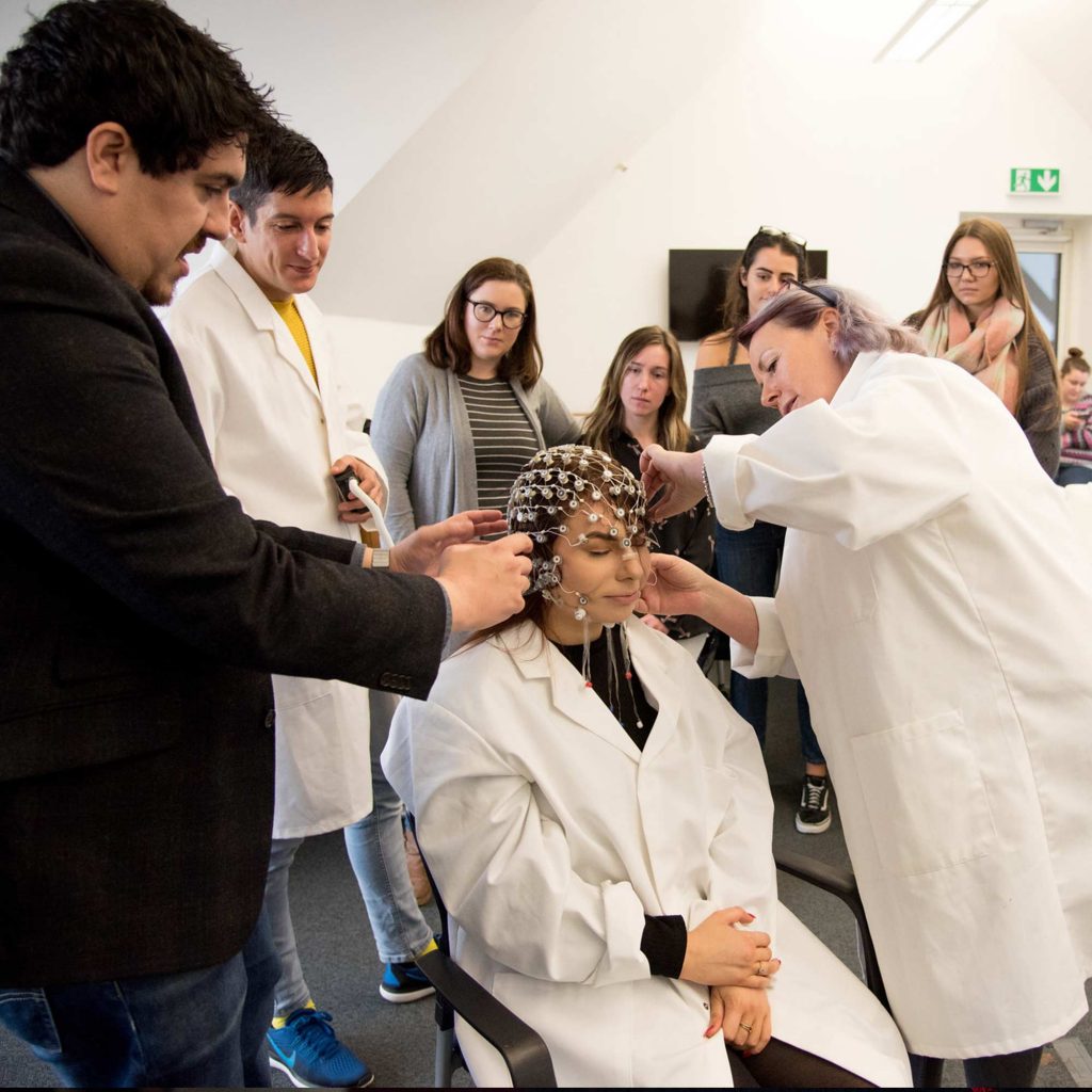 Students and lecturer in an EEG workshop