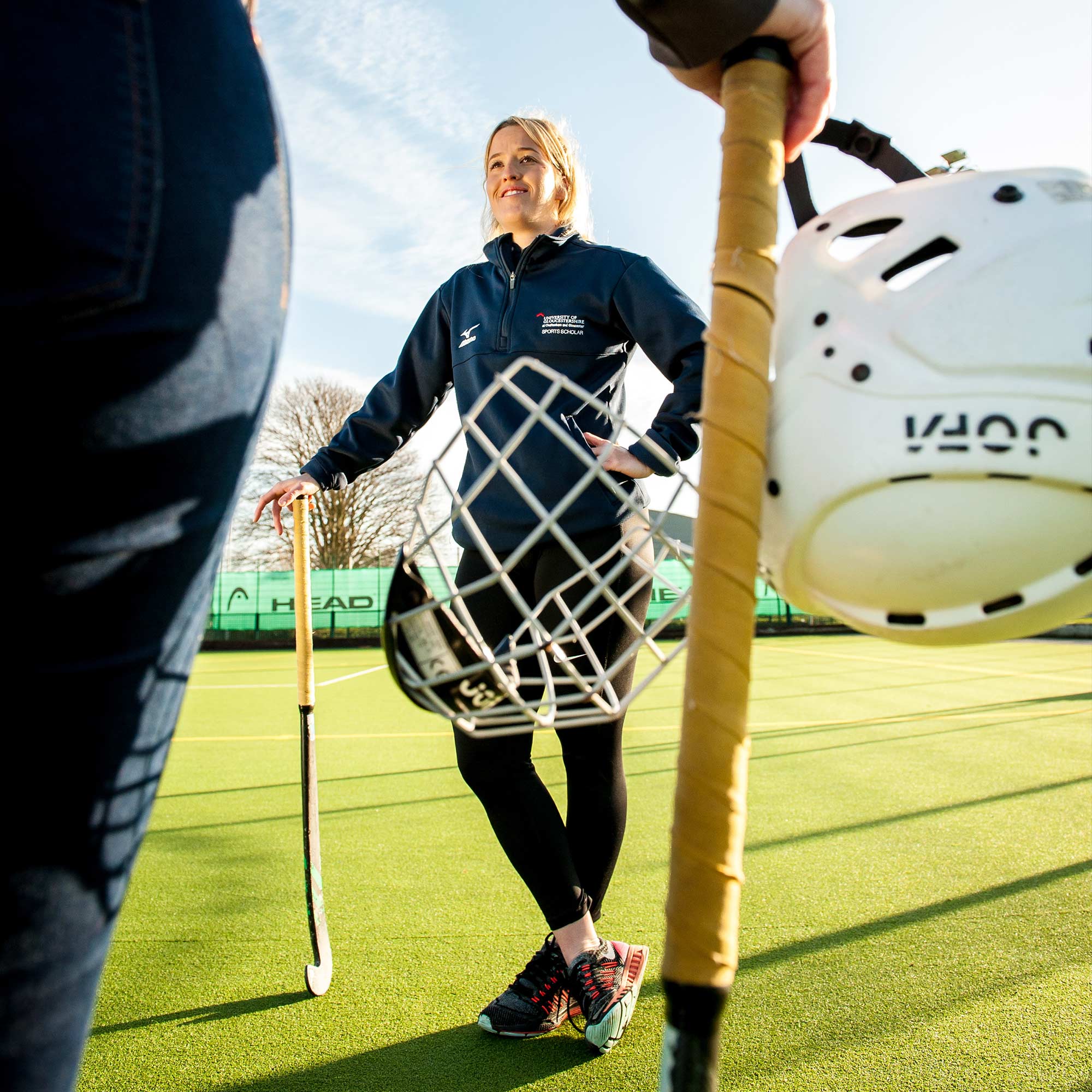 Female hockey player with her equipment