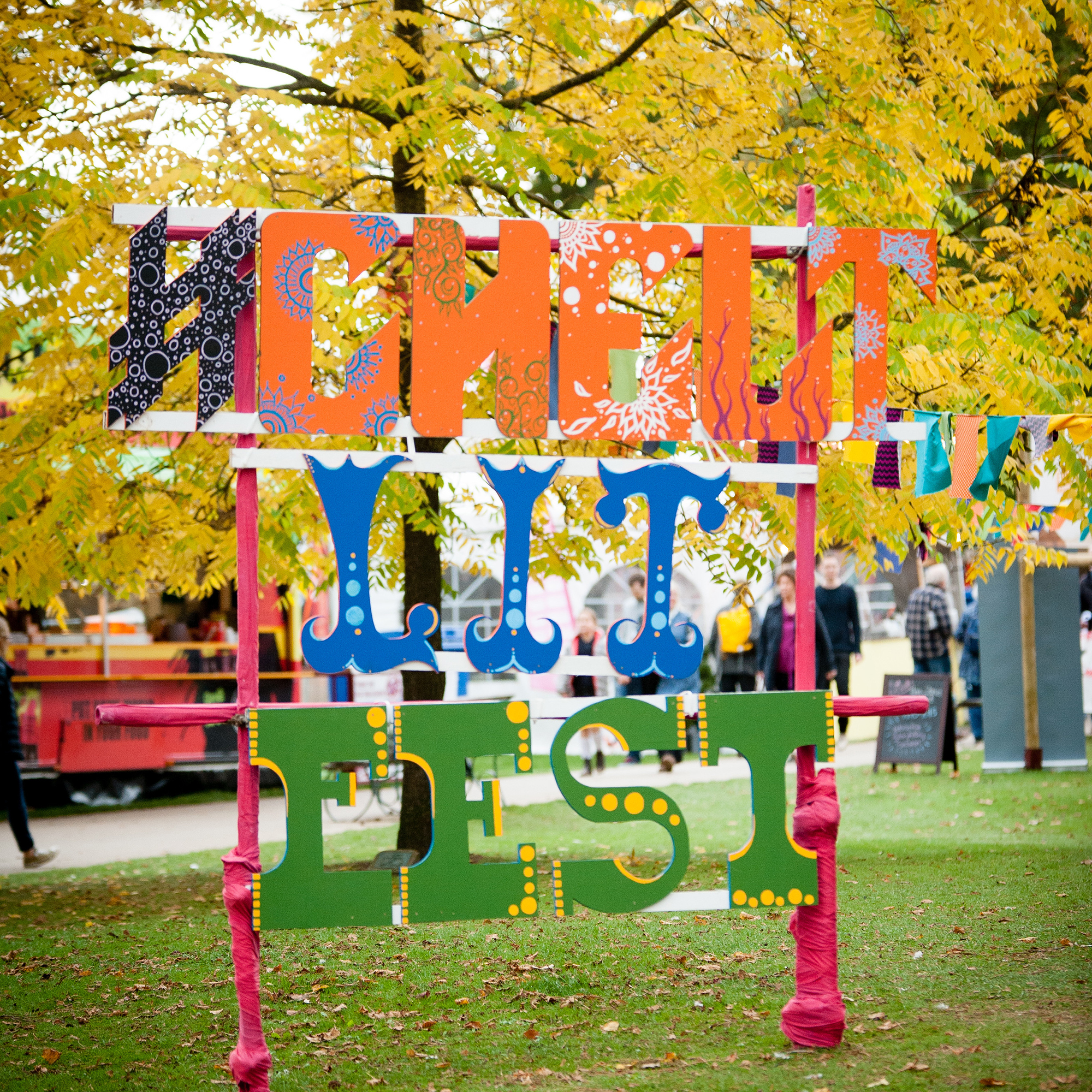 A seventies-style sign that reads Chelt Lit Fest