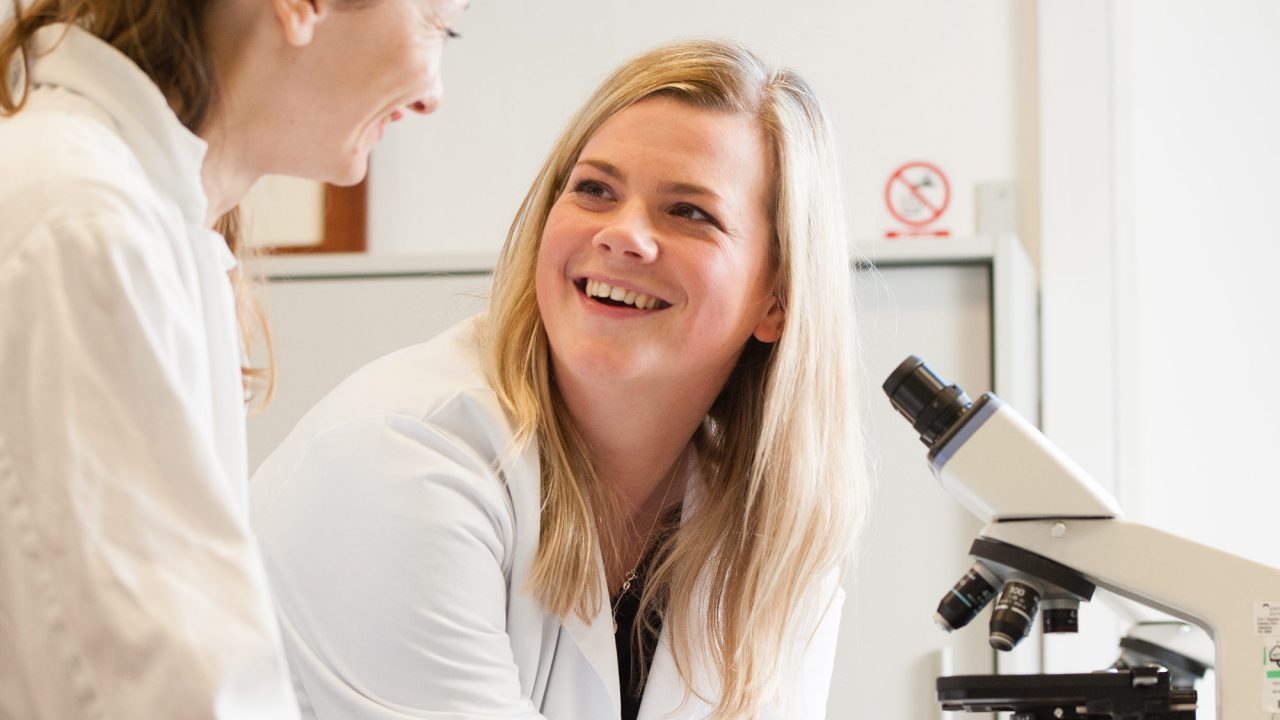 Students on Ecology and Environmental Science course looking through microscopes at Francis Close Hall campus