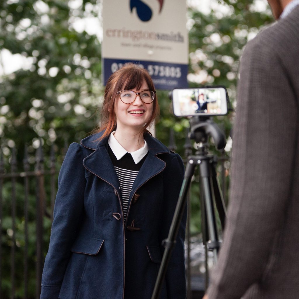 student interviewing member of public