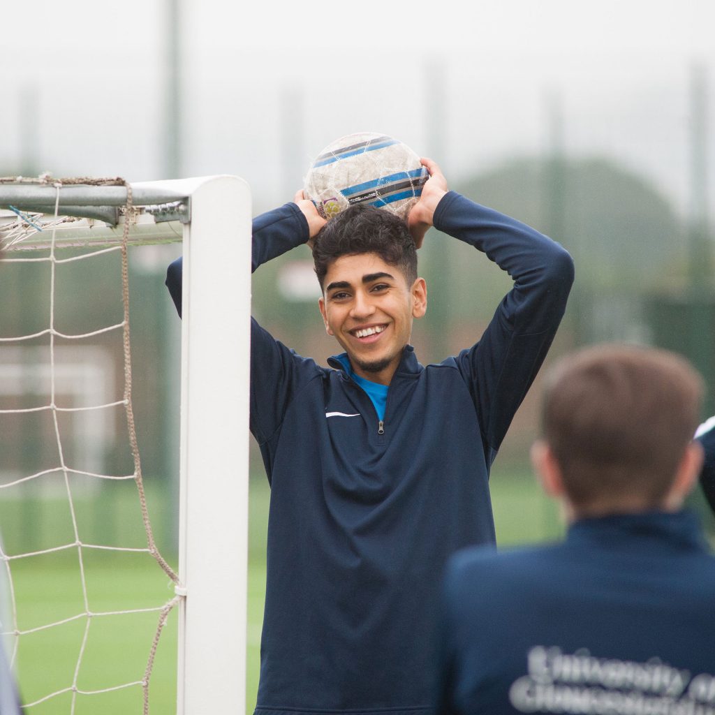 Student with football