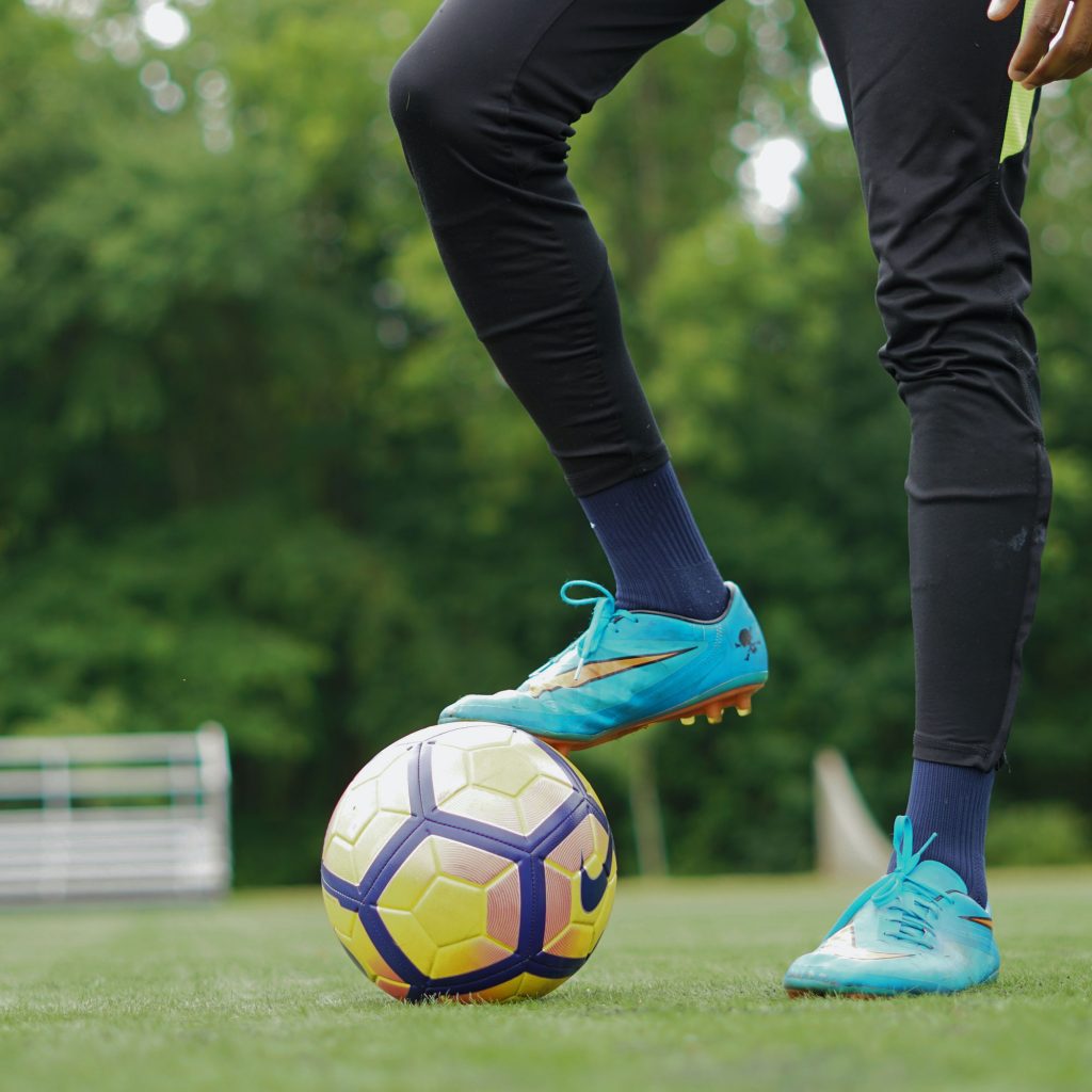 Footballers feet with football