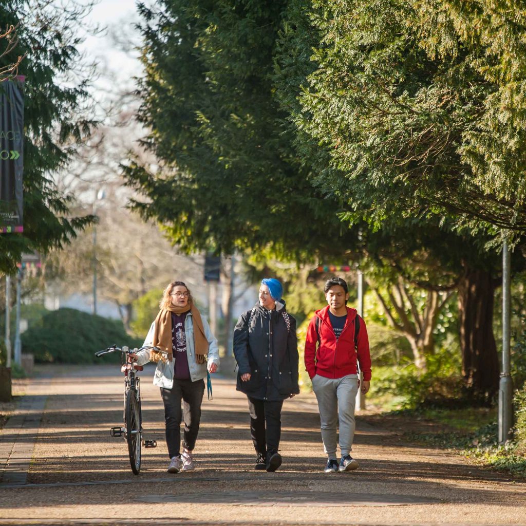 Students walking in park campus