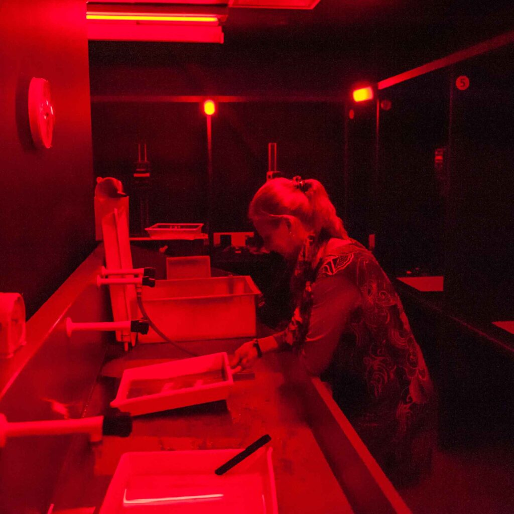 Student in photography studio dark room