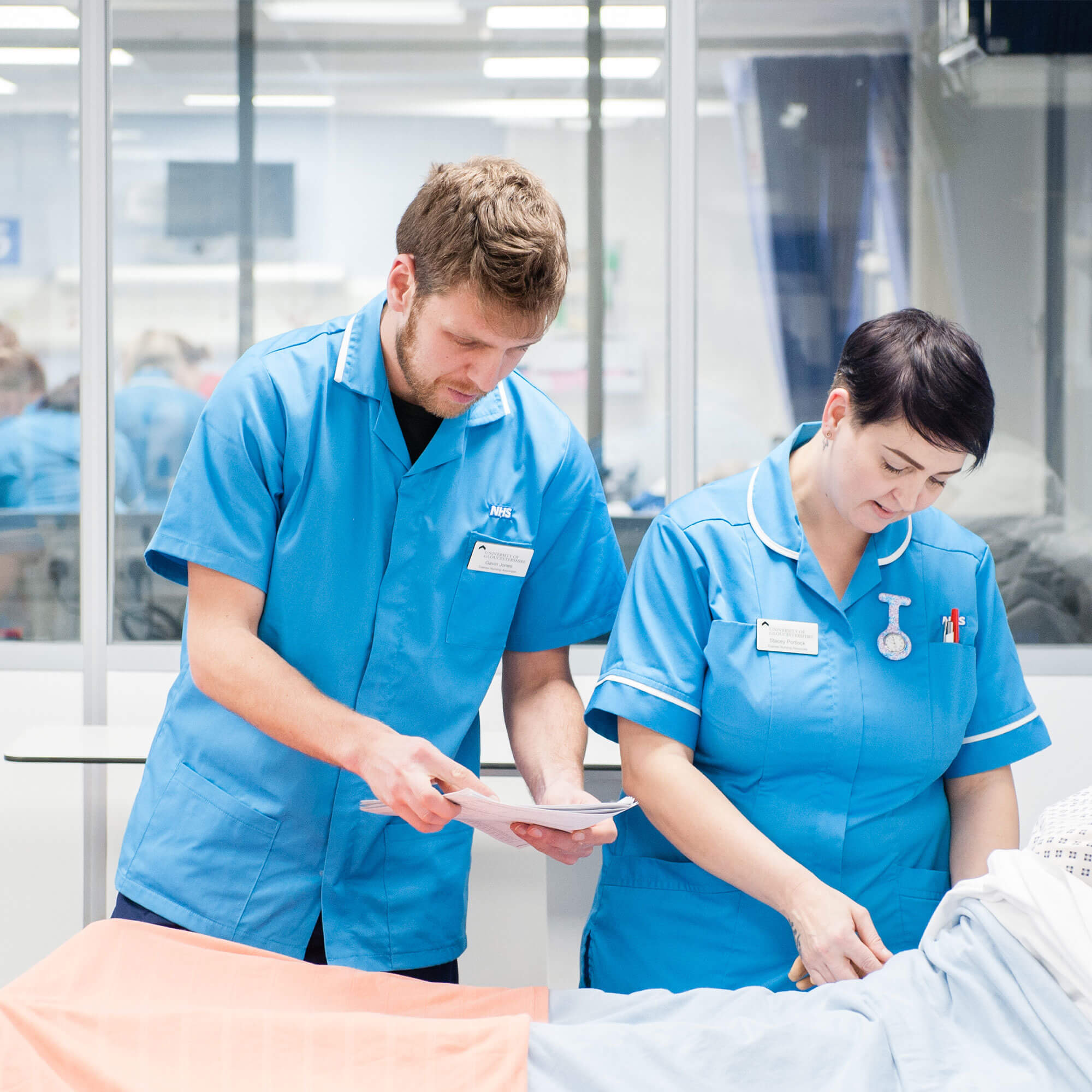 Nurses treating a patient in hospital