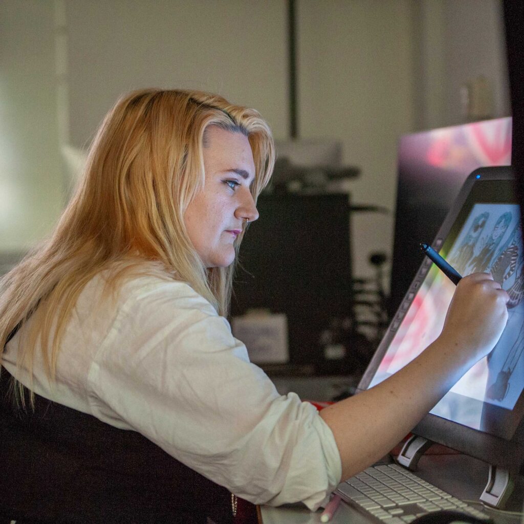 Student uses a touch-screen computer to create an animation.