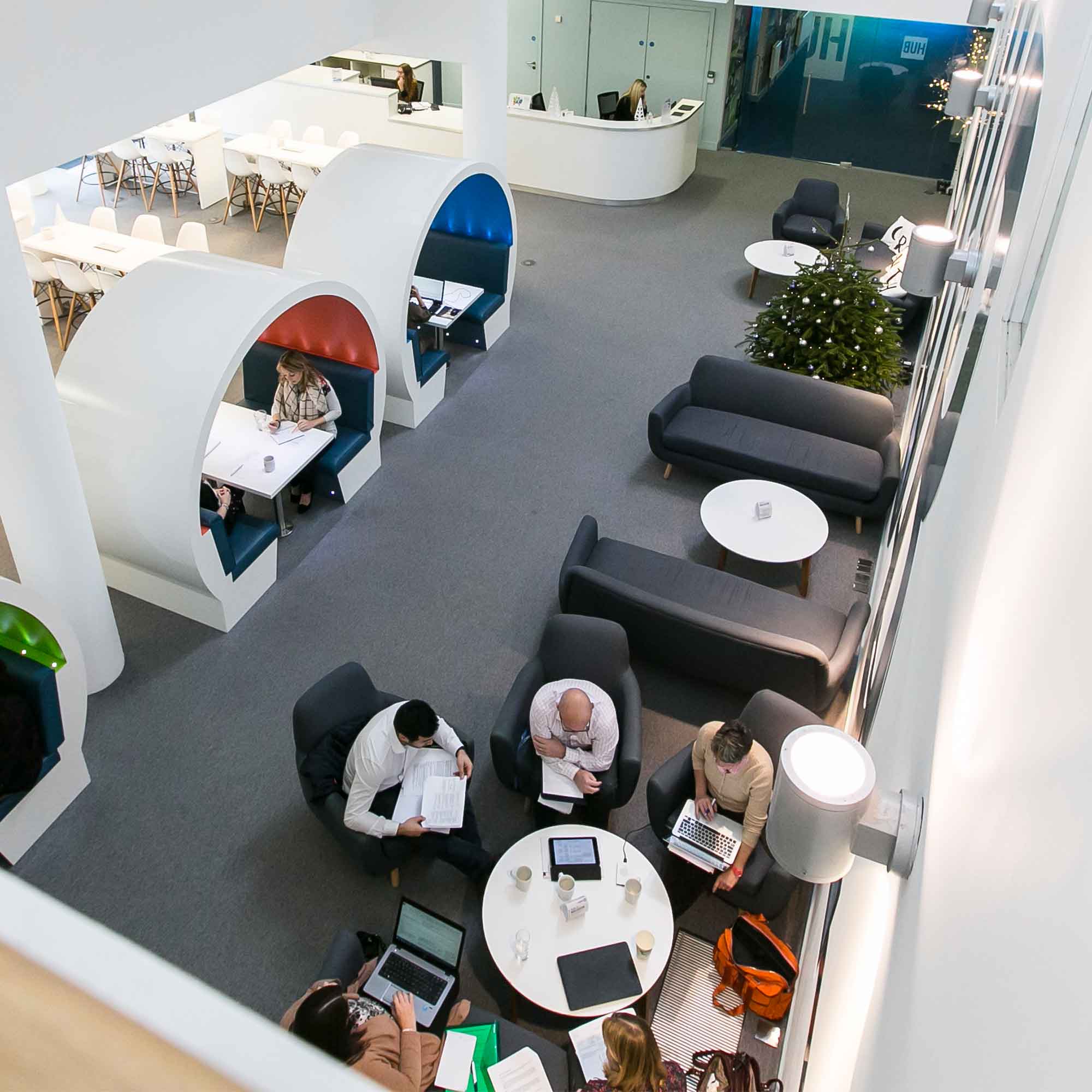 Arial shot of an Growth Hub seating areas with groups of people working.