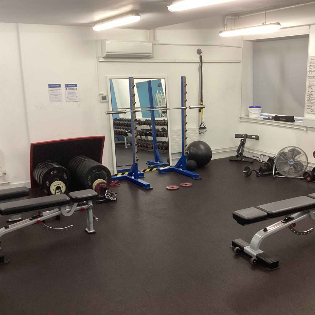Fitness suite with weights, benches and bands.