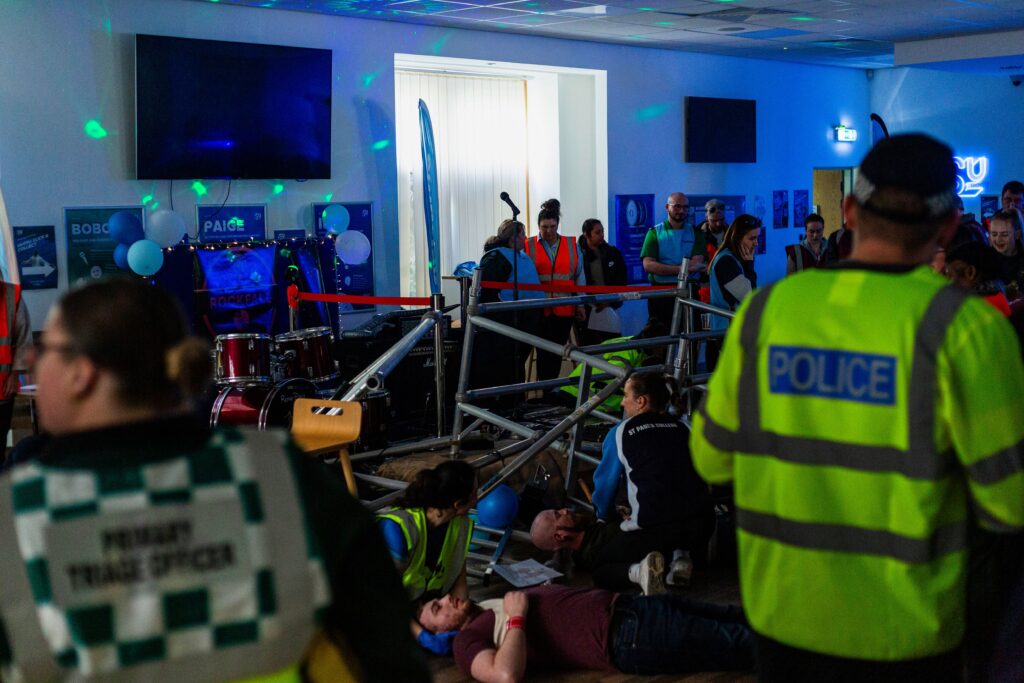 people being treated for injuries after a stage collapses