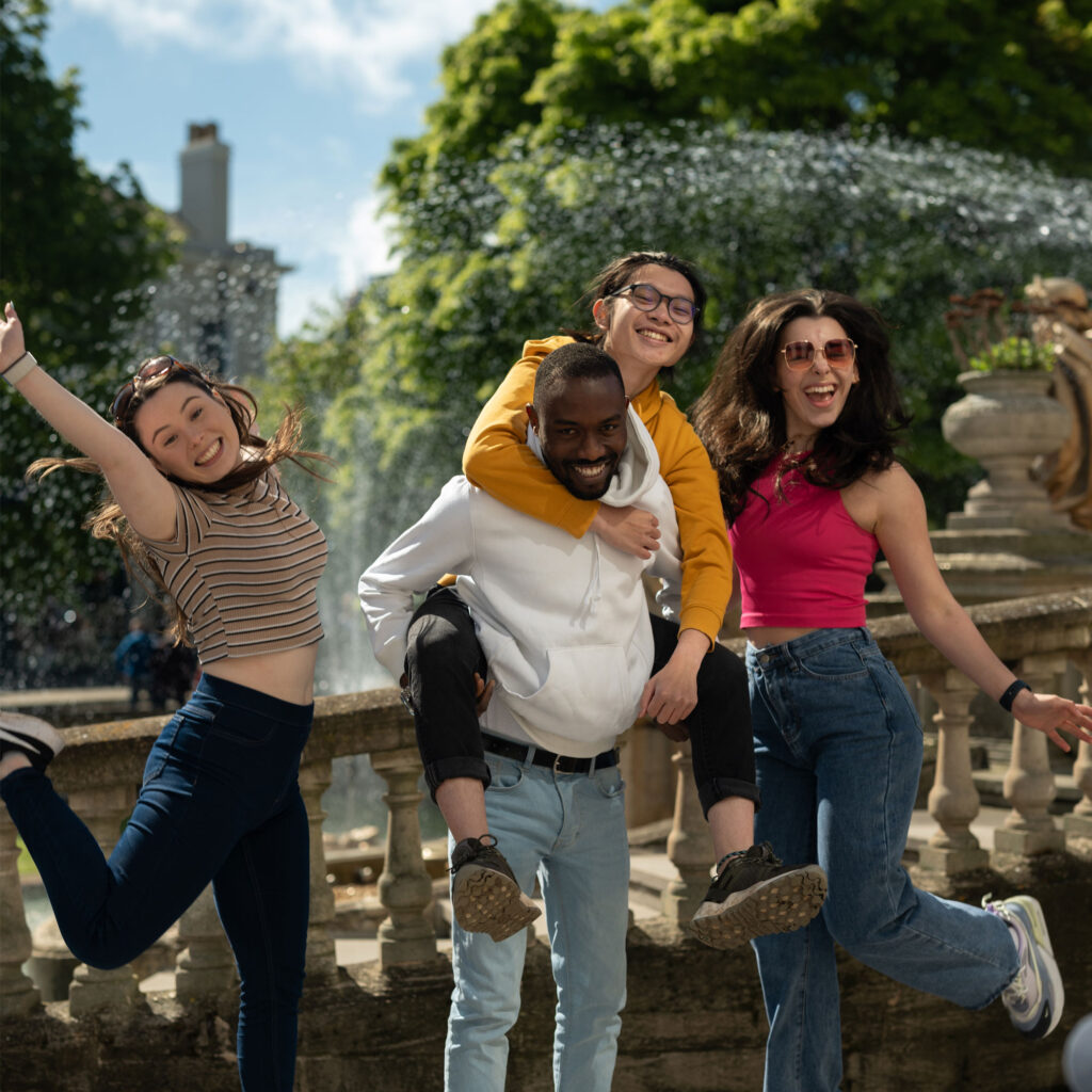 Four students smiling and happy in Cheltenham