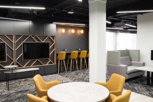 Work spaces at FuturePark showing desks, chairs and computer screens.