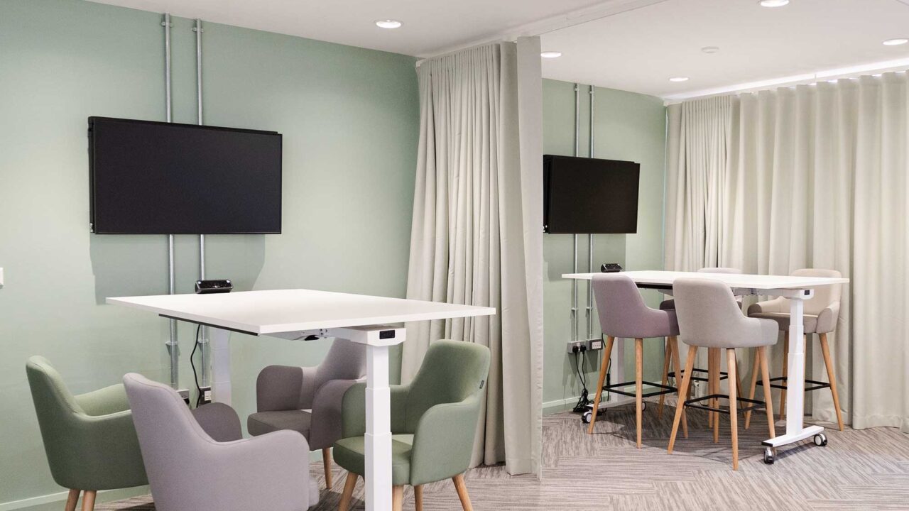 Work spaces at FuturePark showing desks, chairs and computer screens.