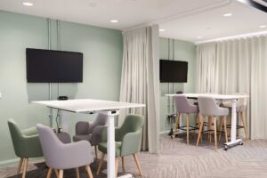 Work spaces at FuturePark showing desks, chairs and computer screens.