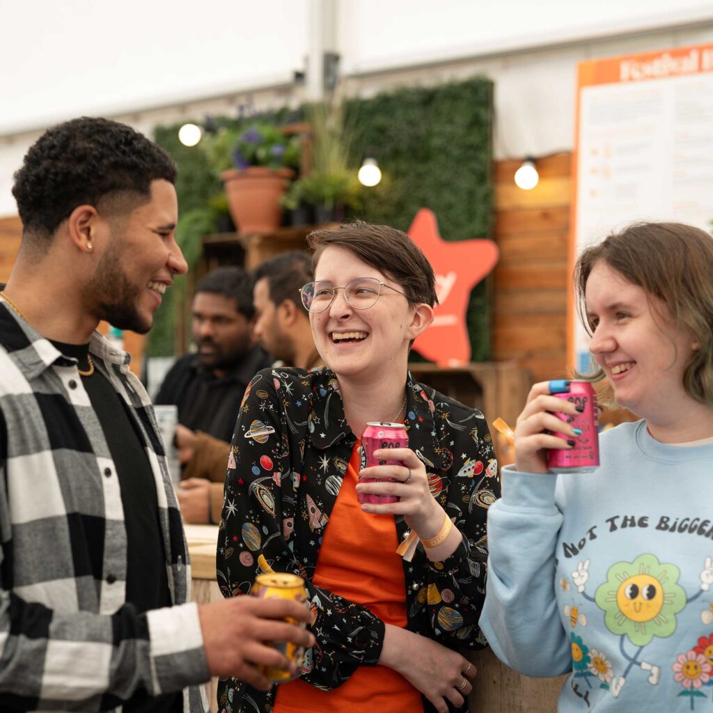 Students socialising together at an outdoor cafe.